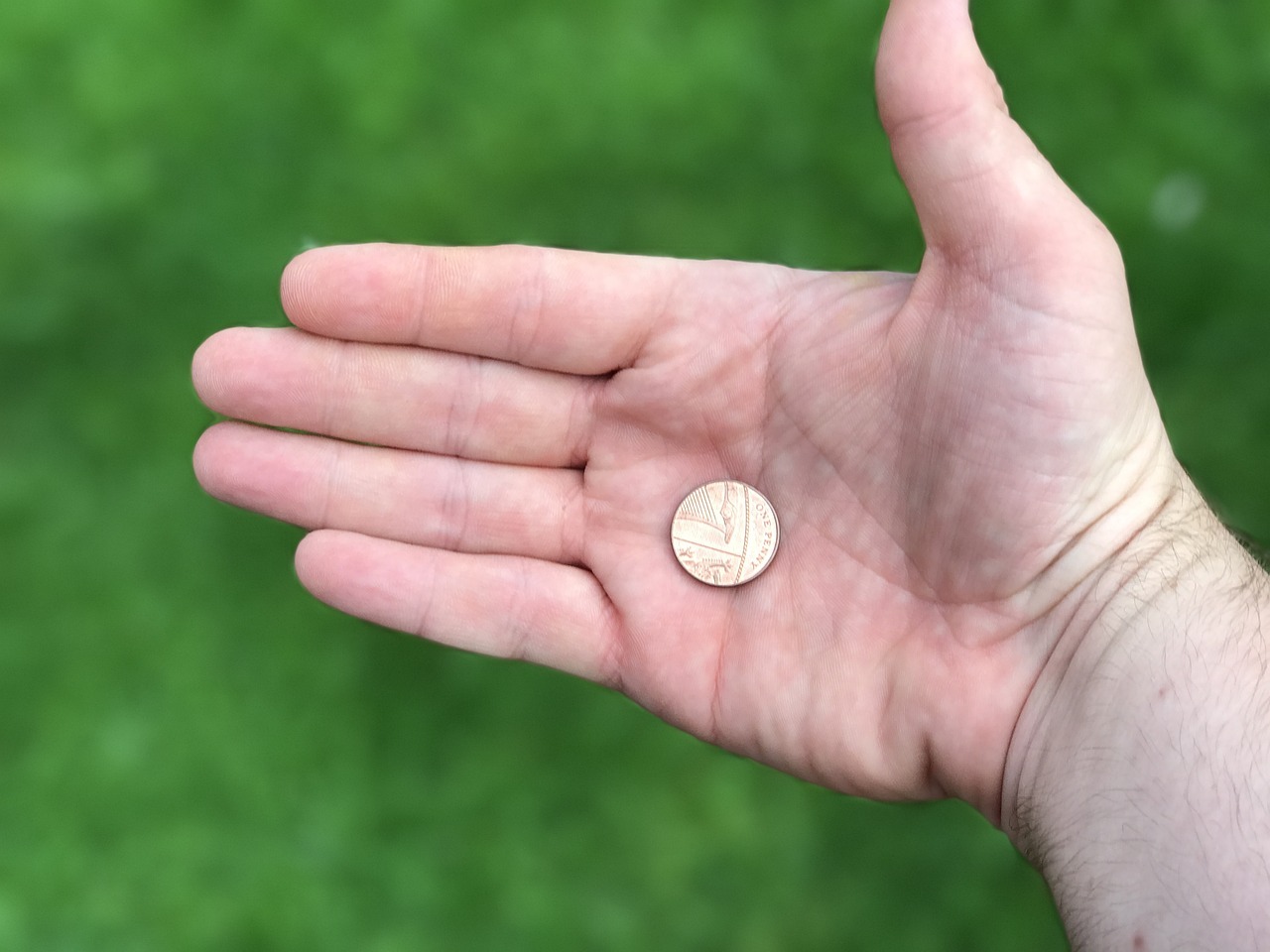Münze in der Hand